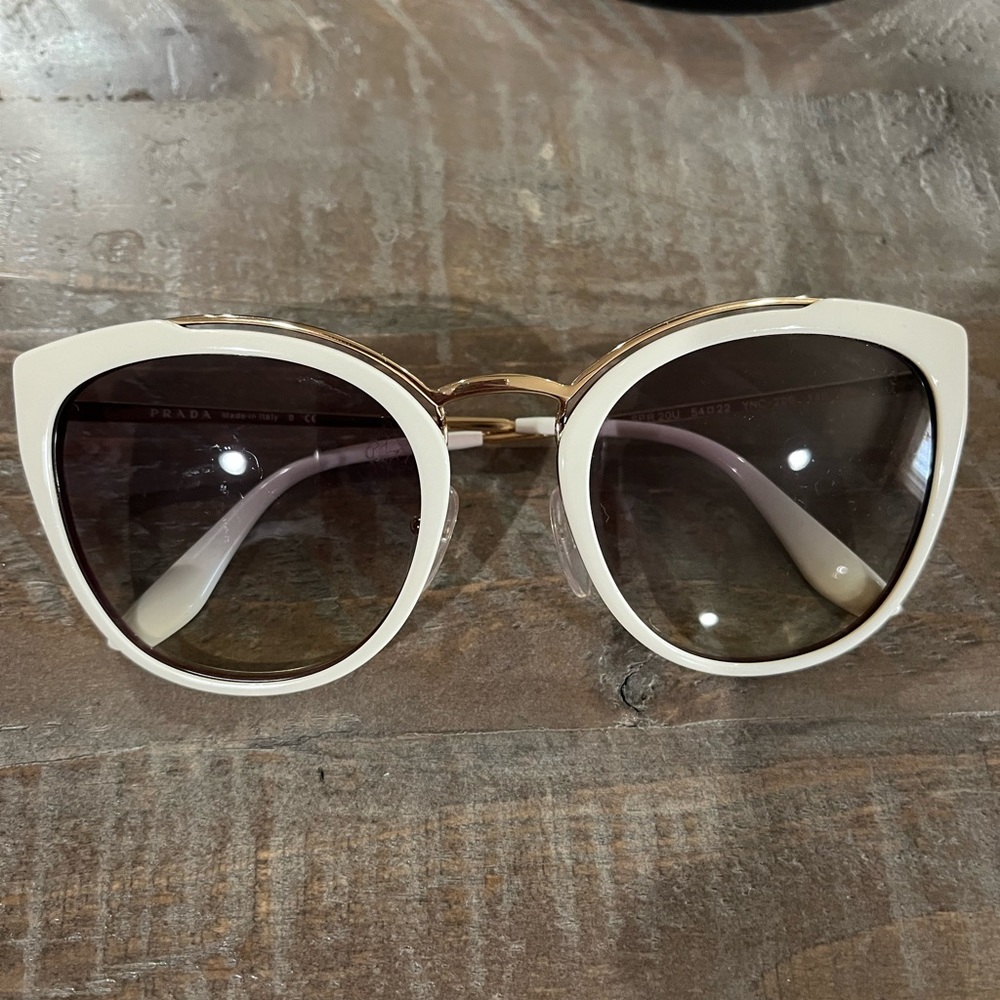 Cream Prada sunglasses with case